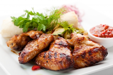 Hot Meat Dishes - Grilled Chicken Wings with Red Spicy Sauceの写真素材