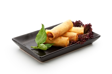 Fried Spring Rolls on Black Dishの写真素材