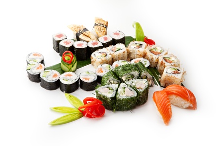 Sushi Set - Different Types of Maki Sushi and Nigiri Sushi. Served on Green Leavesの写真素材