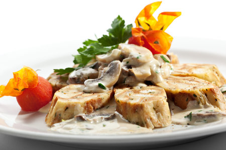 German Home-made Dumpling - Served as Sliced Rolls with Mushrooms and Cream Sauceの写真素材