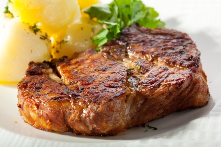 Pork Steak with Potato and Parsleyの写真素材