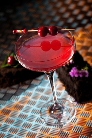 Red Alcoholic Cocktail with Cherry. Martini Glassの写真素材