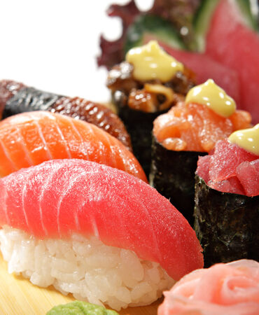 Sushi Set - Salmon, Conger and Tuna Sushi with Salad Leafの写真素材