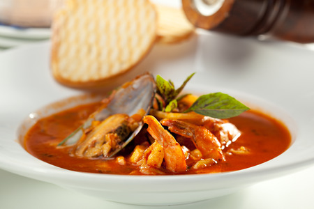 Seafood Soup with Bread and Basilの写真素材