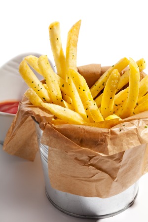French Fries with Red Sauce over Whiteの写真素材