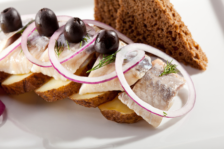 Homemade Food - Soft Salted Fish with Onions and Roasted Potatoの写真素材