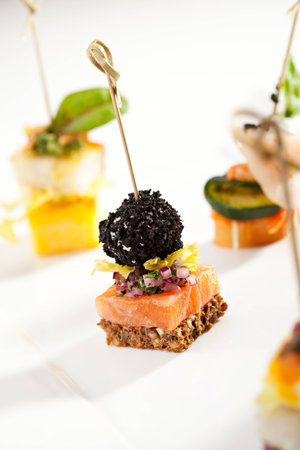 Seafood and Vegetables Canapes on White Dishの写真素材