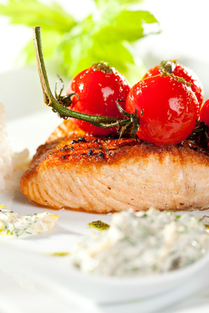 Salmon Steak with Fresh Celery and Cherry Tomatoの写真素材