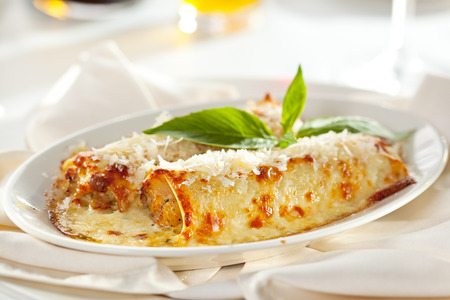 Tasty Cannelloni Topped with Basil Leafの写真素材