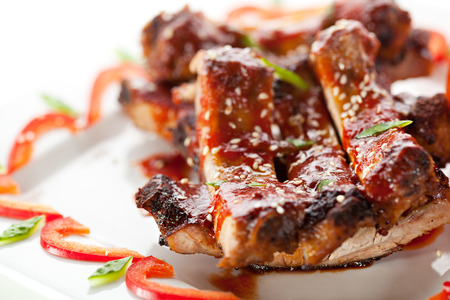 Hot Meat Dishes - BBQ Ribs with Tomatoes and Spicy Sauceの写真素材