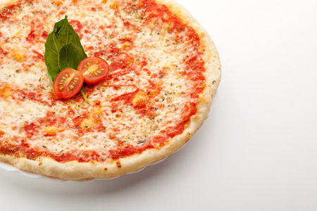 Pizza Margherita made with Tomatoes, Gauda Cheese and Mozzarellaの写真素材