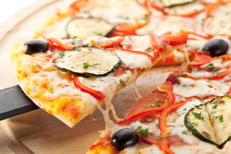 Vegetarian Pizza made from Mozzarella Cheese, Paprika, Tomatoes and Mushroomsの写真素材