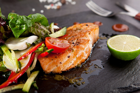 Grilled Salmon with Vegetables and Limeの写真素材