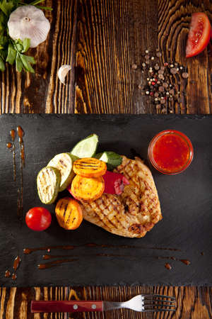 Grilled Chicken with BBQ Vegetables and Spicy Sauceの写真素材