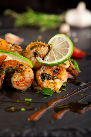 Hot Shrimp Appetizers with Herbs and Tomatoの写真素材
