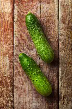 Healthy Organic Vegetables on Rustic Wooden Background. Closeup on Fresh Cucumberの写真素材