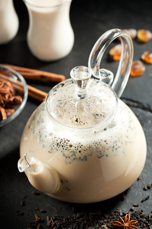 Masala Indian Tea with Spices on a Dark Backgroundの写真素材