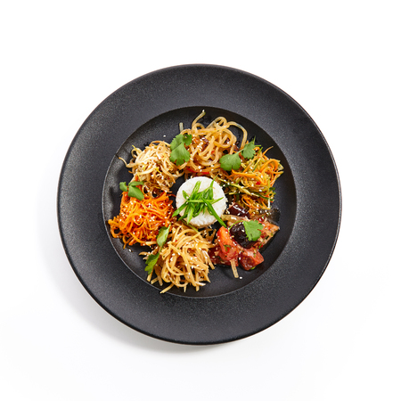 Set of vegetable snacks in Asian style with sesame and fresh herbs on an black plate. Pan-Asian cuisine in  restaurant. Top Viewの写真素材