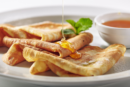 Crepes with Honey and Mint Leafの写真素材