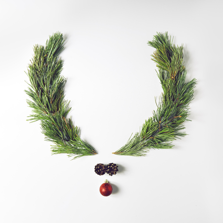 Reindeer face made of pine branches and christmas decoration. Merry Christmas and Happy New Year Concept. Flat Layの写真素材
