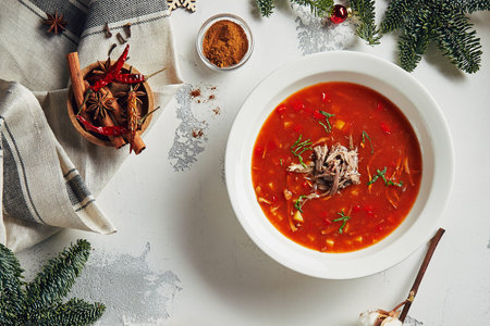 Beautiful Vintage New Year Background with  Homemade Red Tomato Soup Top View. Cozy Christmas Table...