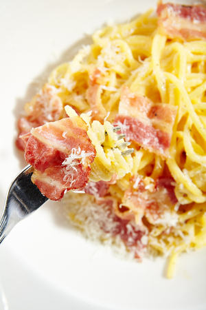 Yummy Spaghetti Carbonara with Grated Parmesan Cheese.の写真素材