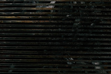 Old Empty Barbecue Grill Texture with a Thick Layer of Soot and Carbon. Dirty Iron Bbq Lattice...