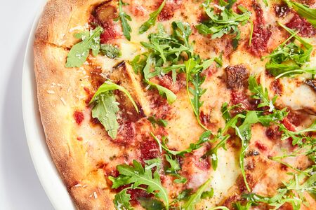 Pizza with porcini mushrooms and truffle oil top view. Pizzeria dish, menu item. Traditional italian junk food isolated on white background. Unhealthy nutrition, delicious fast food close upの写真素材