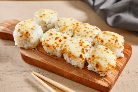 Baked shrimp rolls on wooden board top view.の写真素材