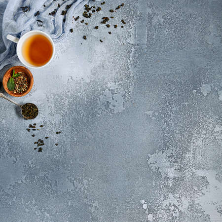 Tea composition on blue background. Top view, copy space. Tea drink and sweet jam overheadの写真素材