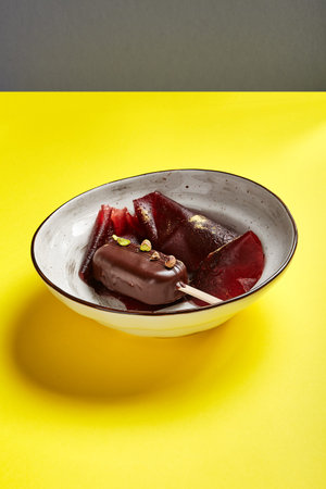 Chocolate mousse dessert close up. Luxury restaurant sweet course side view. Ice cream served with...