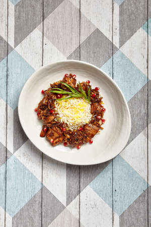Variety meats with basmati overhead. Offal with rice in deep plate top view. Luxury restaurant delicacy serving. Gourmet food portion. Culinary arts. Pluck side dish. Fancy meal courseの写真素材