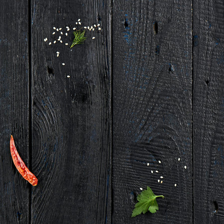 black wood background. Food ingredient background with copy space. Dark background with food ingredients. retro style. wood floor vintage textureの写真素材