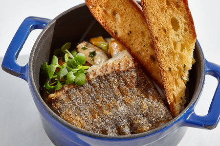 Seafood stew with roast cod and crispy ciabatta. Mussels tomato soup with fish and roast bread....