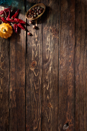 Rustic wooden surface featuring autumn harvest accents, perfect for fall season compositions, with a top-down perspective and space for text.の写真素材