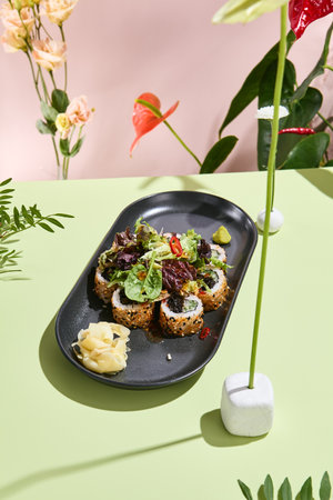 Vegetarian Sushi Roll with Sesame, Mixed Salad, and Fresh Vegetables. Perfect for health-conscious dining and plant-based cuisineの写真素材