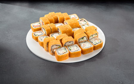 Set of hot tempura rolls, a crispy and satisfying selection for those who love a warm twist on sushi.の写真素材