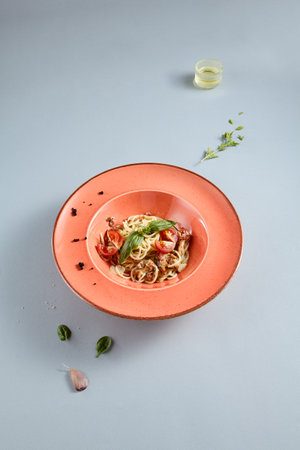 Delightful Carbonara pasta served in a terracotta dish, top view perfect for Italian cuisine recipes and food bloggers.の写真素材