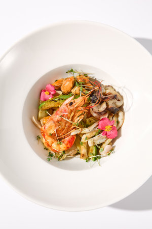 Top View of Zucchini Seafood SautÃ© with Shrimp and Floral Garnish.の写真素材