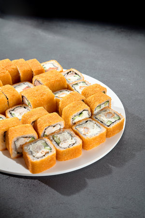 Set of hot tempura rolls, a crispy and satisfying selection for those who love a warm twist on sushi.の写真素材
