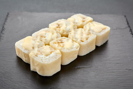 Sweet roll with coconut flakes in a pancake, a delightful fusion of Japanese and Western dessert traditions.の写真素材