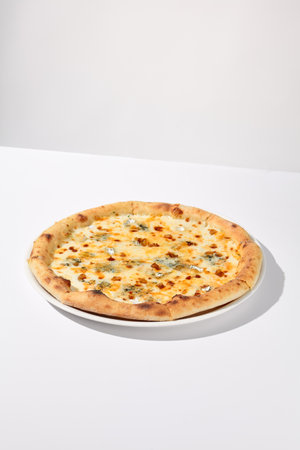 Italian Quattro Formaggi Pizza with Four Cheeses Isolated on White.の写真素材