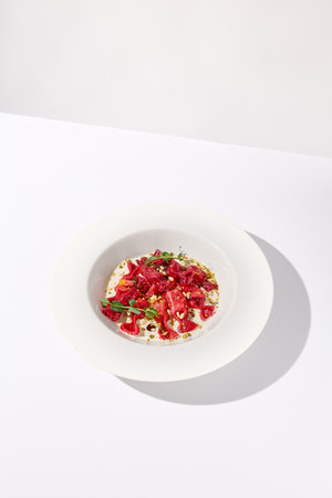 Beetroot Ravioli Bowls with Cream Sauce, a Delightful Vegetarian Dish for Gourmet Food Enthusiasts.の写真素材