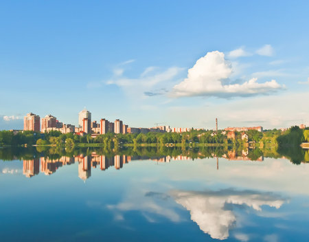 houses trees and clouds reflected in a river. Donetsk, Ukraineの写真素材