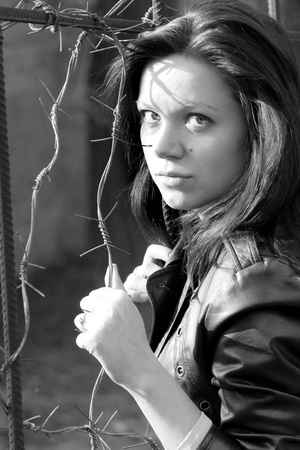 the girl next to barbed wireの写真素材