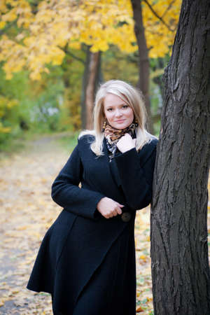 portrait of a girl standing near a treeの写真素材