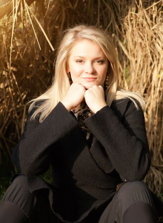 Autumn portrait of blonde girlの写真素材