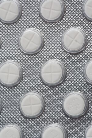 Packing pills isolated on a white backgroundの写真素材