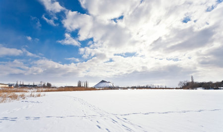 view above frozen lake in winter . most path of the tracksの写真素材