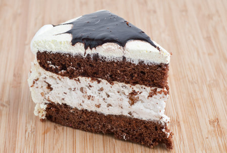 Tasty Chocolate Cake Slice on a wooden board
